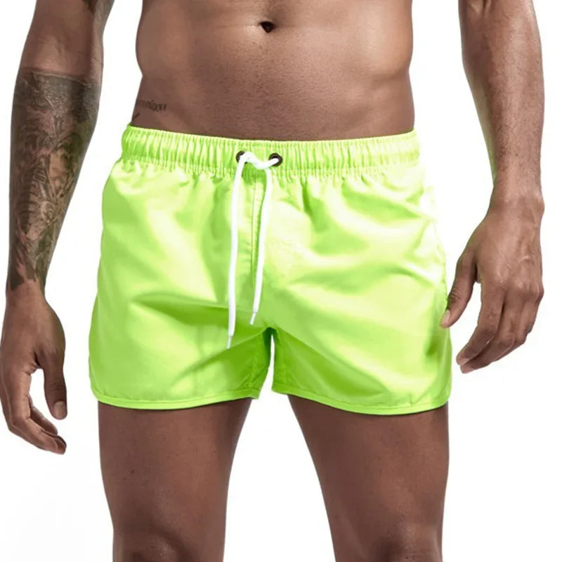 Men's quick-drying swimming trunks in vibrant colors for beach and surfing