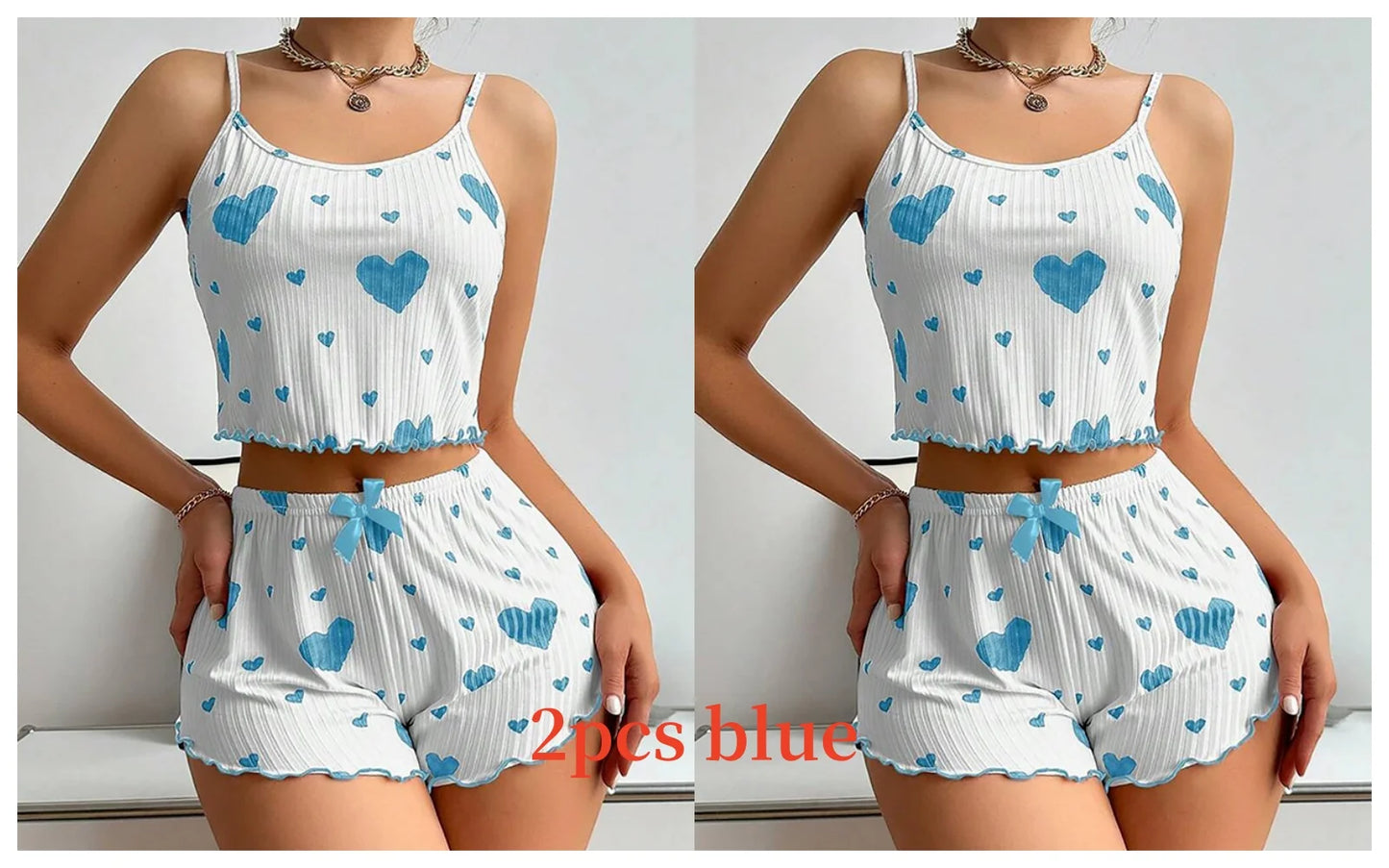 White sleeveless top and shorts set with blue heart patterns worn by a person. Soft women’s pajama set, 2 pieces white tank top and shorts, breathable fabric with love print, comfortable casual sleepwear, UK FTF Market.
