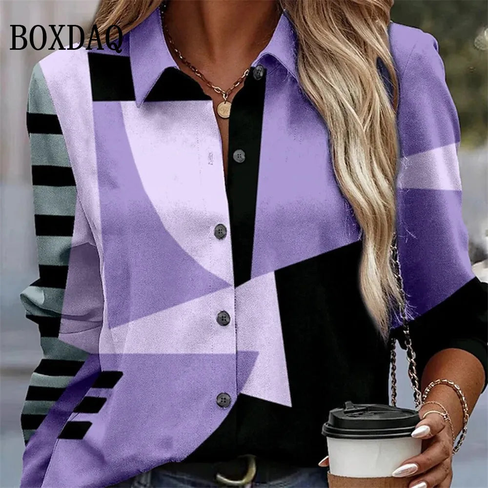 A woman wearing a short-sleeve button-up shirt with a bold geometric color-block pattern in purple, lavender, black, and gray. The brand name 'BOXDAO' is visible as an overlay on the top left.