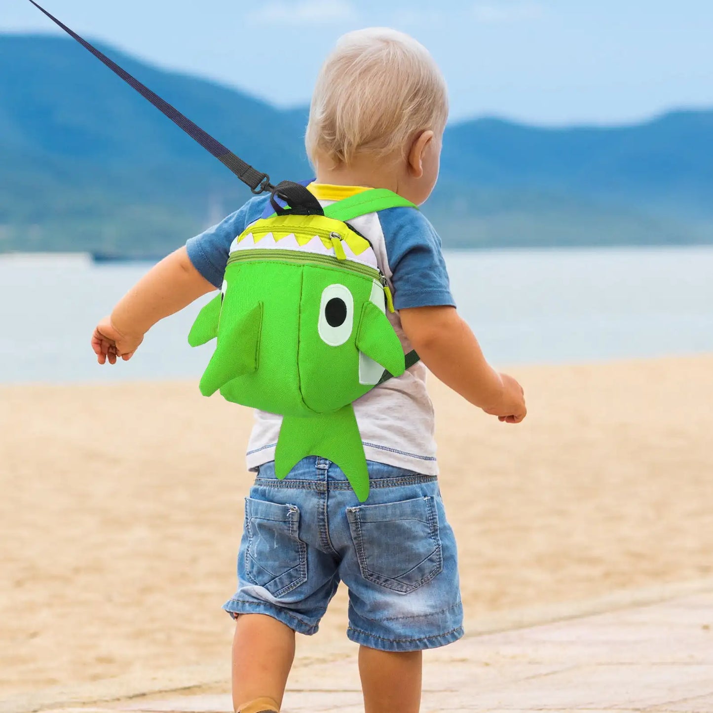 Colorful toddler backpack with attached safety leash for outdoor activities