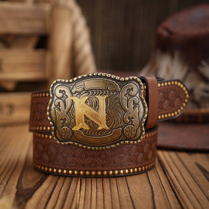 Brown leather belt with gold buckle featuring a large 'K' on a wooden surface.