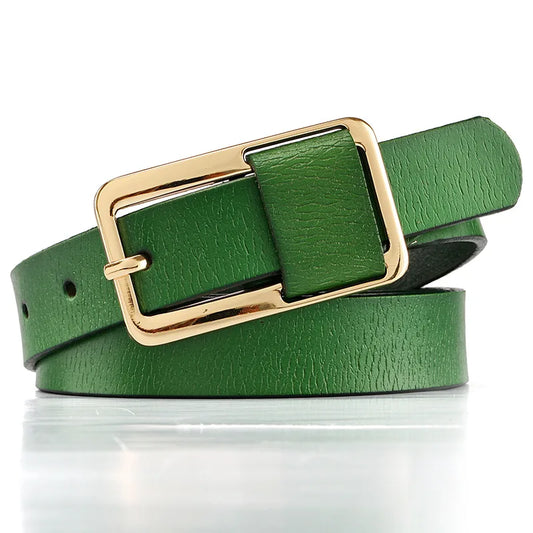 Green belt with a gold buckle on a white background. Women’s wide leather belt with cinched design and metal buckle. Enhances waistline for shirts, dresses, suits. Trendy, durable, UK fashion accessory.