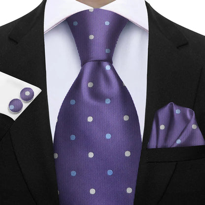 Man wearing a black suit with a purple tie, pocket square, and cufflinks featuring white polka dots. Elegant men’s 3-piece tie set: striped necktie, floral pocket square, matching cufflinks. Fashionable polyester accessories for formal occasions.