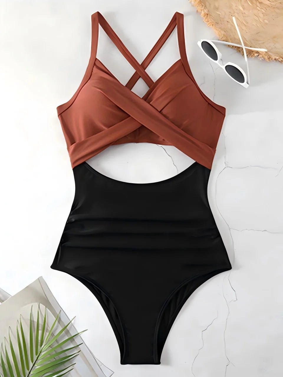 Black swimsuit with brown top on a white surface