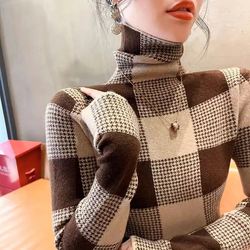 Mannequin wearing a checkered sweater with a blurred background