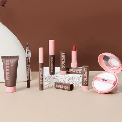 Collection of makeup products including lipsticks, mascara, and BB cream on a neutral background. HiVi makeup gift box with limited edition lipstick, setting powder, and eyeliner. Perfect romantic gift for women. Safe, elegant, lasting wear.