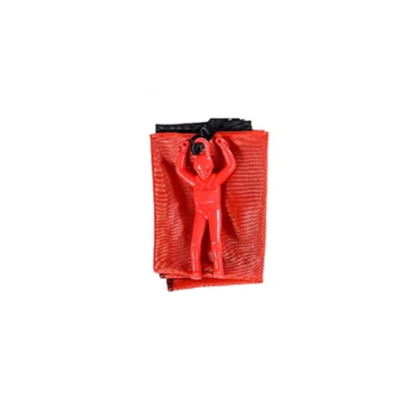 Red plastic bag with a small figure inside on a white background. Colorful outdoor parachute toy for kids, tangle-free design. Durable plastic, unisex gift idea for boys and girls. UK delivery ftf fashion.