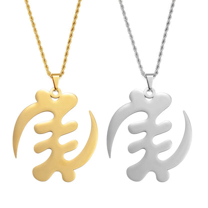 Gold and silver leaf-shaped pendants on white background