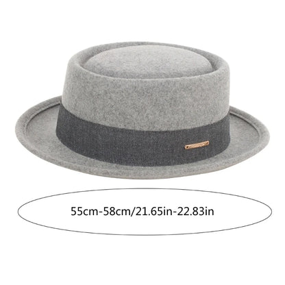 Gray fedora hat with a black band on a white background. Fedora hat polyester unisex carnival mask, gentleman style, costume accessory, roll trim hat for party and carnival events.