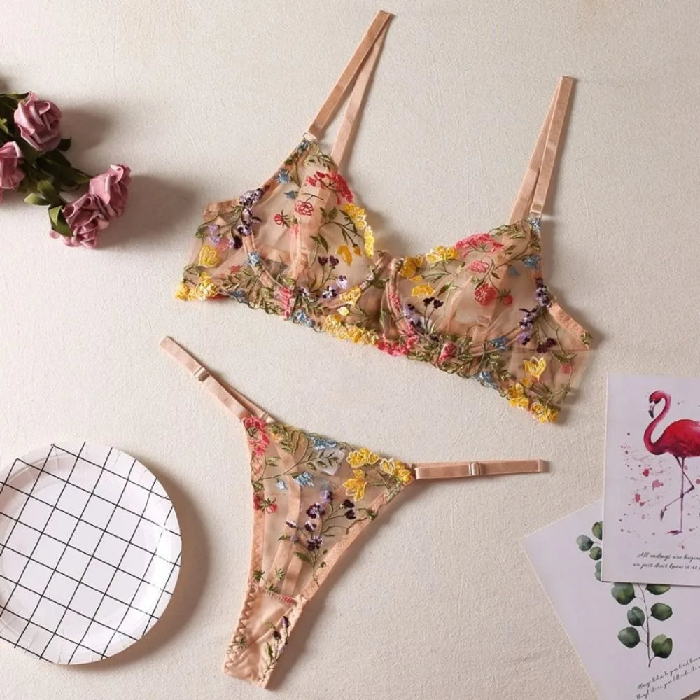 Floral lingerie set on a light background with decorative elements.