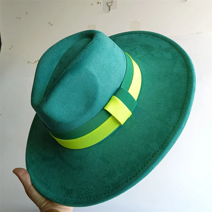 Green hat with a yellow band held against a light background