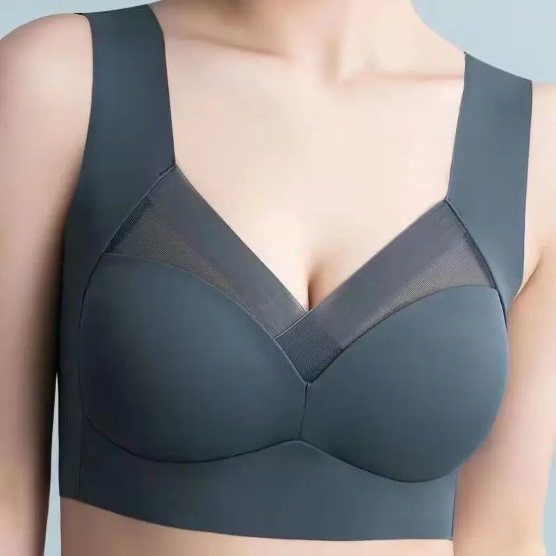Gray bra worn by a person on a light blue background