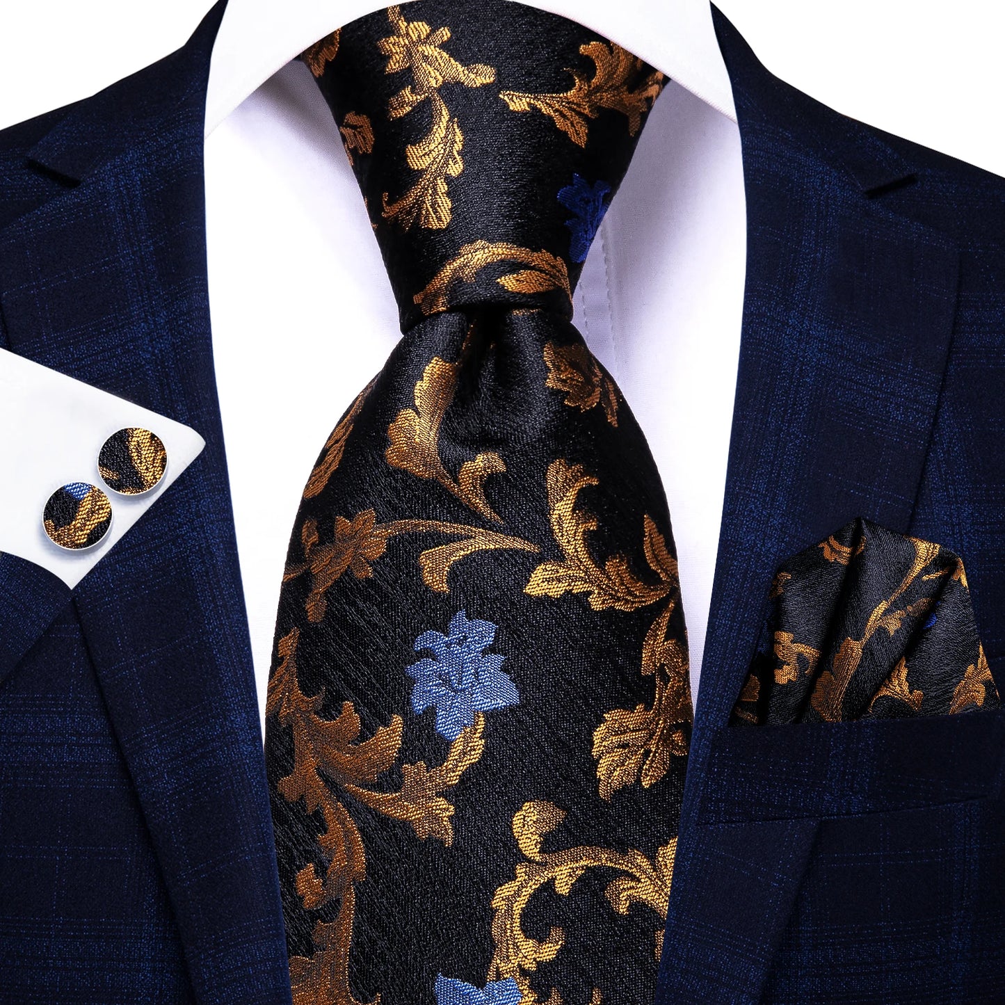 Navy blue suit with gold floral tie, pocket square, and cufflinks on a white background. Men’s luxury paisley silk tie and pocket square set, 8.5cm wide, for business or wedding. Red formal necktie, ftf fashion UK.