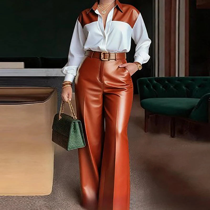 Person wearing a white shirt with brown accents and red pants in an indoor setting.