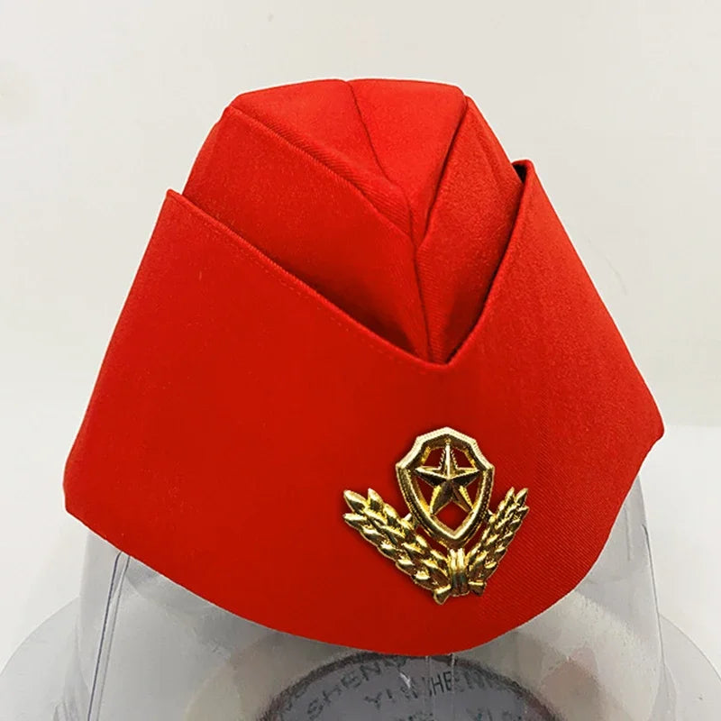 Red fez hat with a gold emblem on a white background
