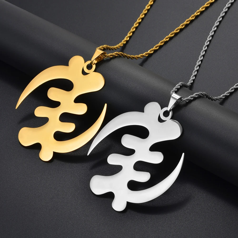 Gold and silver pendants on black background