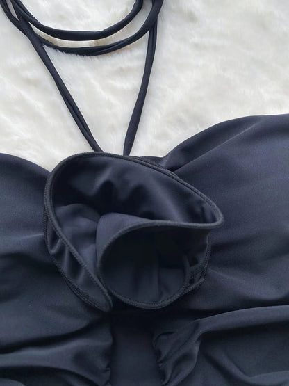 Close-up 3D floral appliqué detail on black monokini — hollow out swimwear women