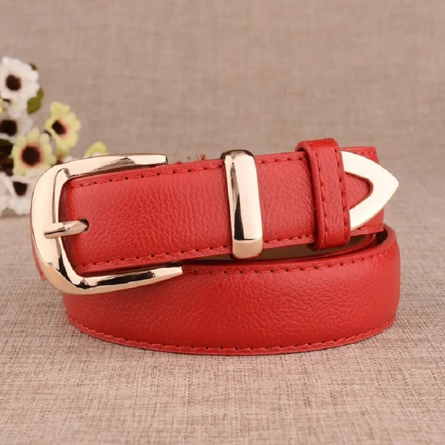 Red leather belt with gold buckle on a beige background. Women’s vintage white leather trouser belt with solid pin buckle. Stylish, high-quality accessory for fashion-forward looks, UK.