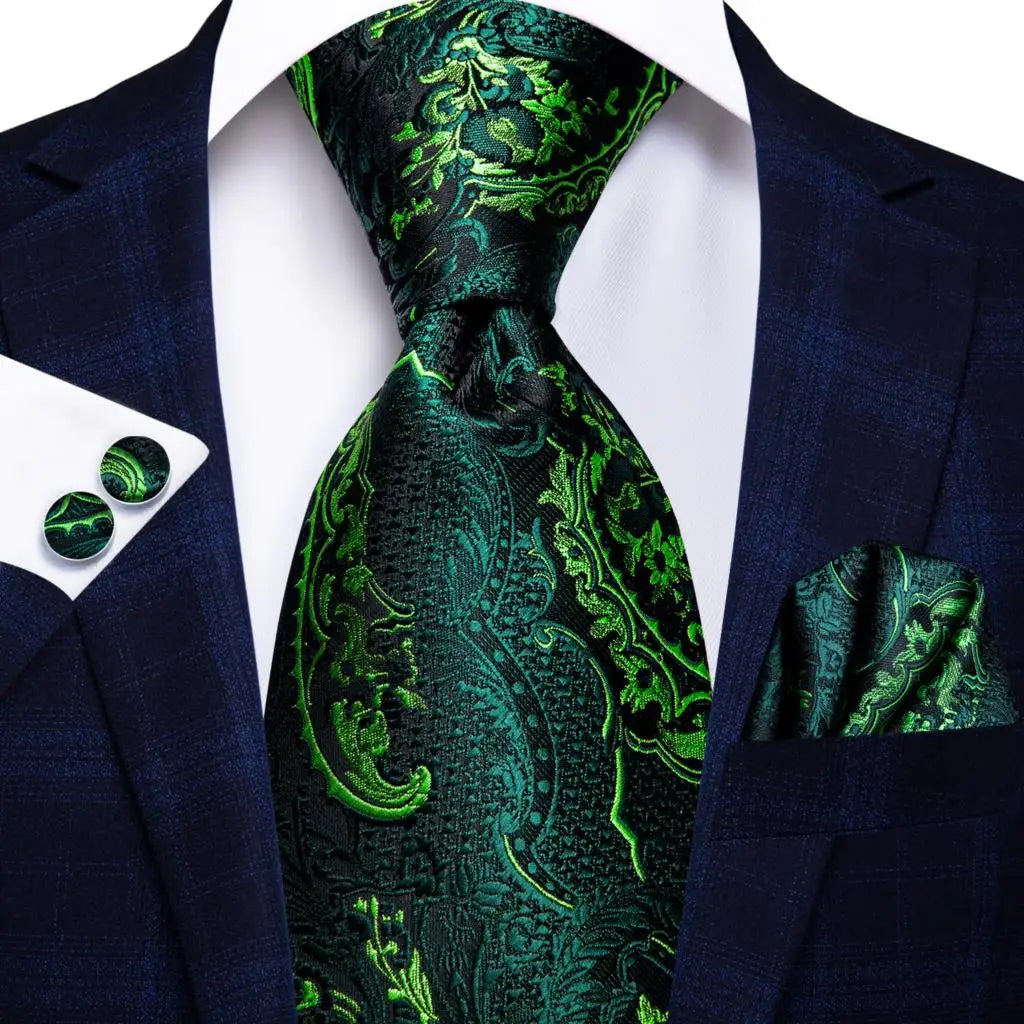 Green paisley tie with matching pocket square and cufflinks on a suit jacket. Men’s luxury paisley silk tie and pocket square set, 8.5cm wide, for business or wedding. Red formal necktie, ftf fashion UK.