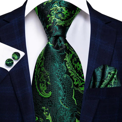 Green paisley tie with matching pocket square and cufflinks on a suit jacket. Men’s luxury paisley silk tie and pocket square set, 8.5cm wide, for business or wedding. Red formal necktie, ftf fashion UK.