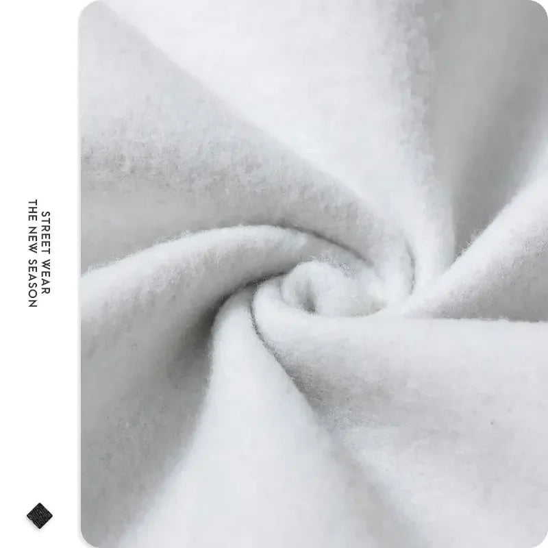 Close-up of gray fabric with 'Street Wear' text on a white background