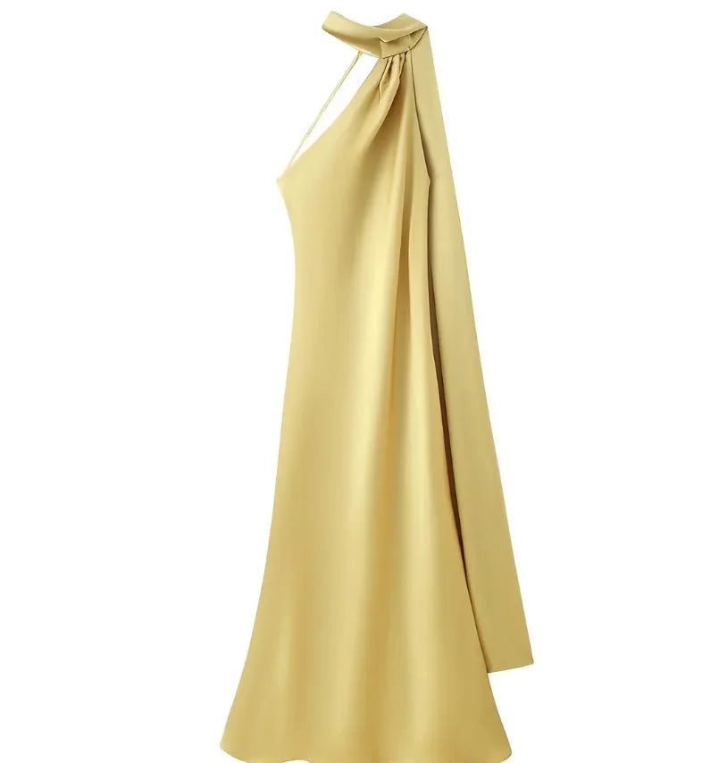 Gold one-shoulder dress on a white background