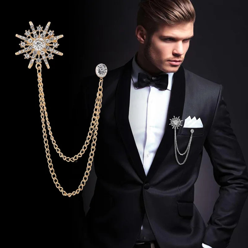 Man in a tuxedo with decorative lapel pins and chain on a black background. Elegant rhinestone lapel pins for men and women. Tassel, crown, floral pins for suits, collars, weddings, parties. Zinc alloy metal, classic style.