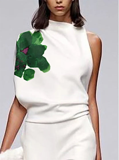 White sleeveless top with a green floral design on a plain background