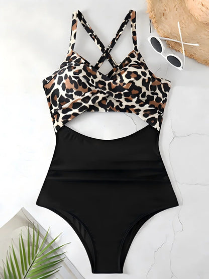 Black swimsuit with leopard print top on a white surface