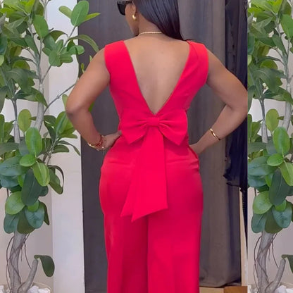 Person wearing a bright red dress with a large bow detail, standing against a neutral background with plants. Women’s striped print blouse and elastic waist pants two-piece suit. Sleek, comfortable, breathable office wear perfect for spring and summer.