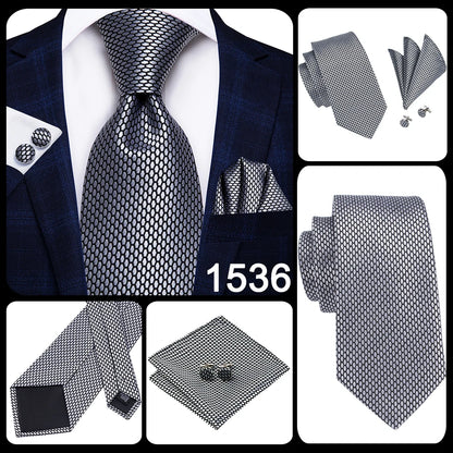 Black and silver patterned tie set with matching pocket square and cufflinks on a white background. Men’s luxury paisley silk tie and pocket square set, 8.5cm wide, for business or wedding. Red formal necktie, ftf fashion UK.