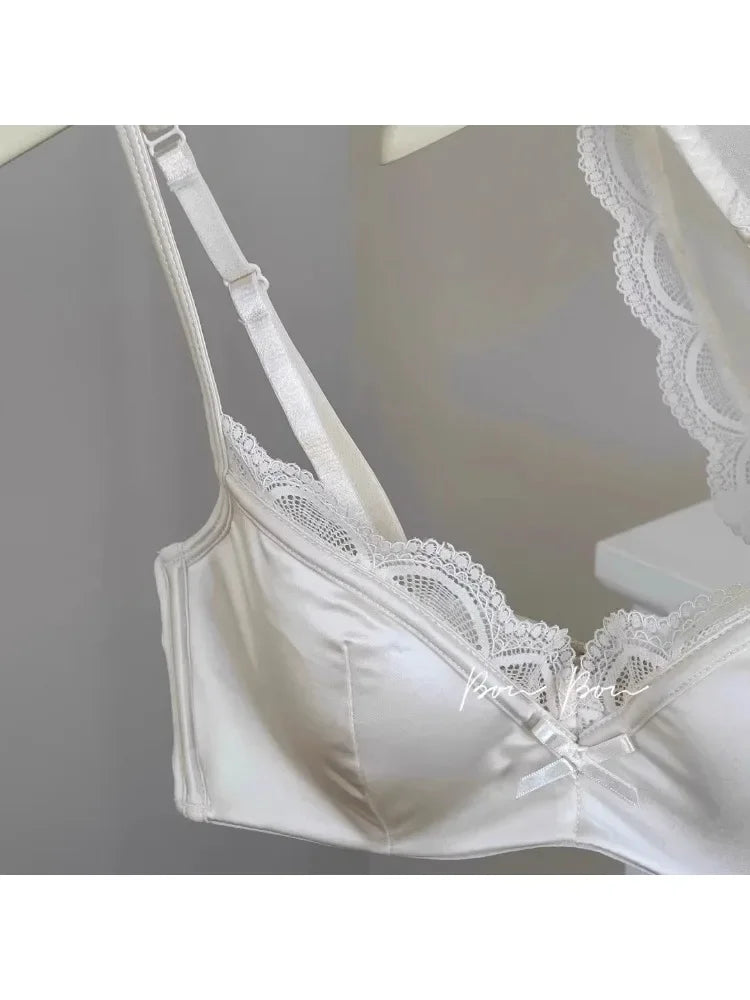 White lace bra on a gray background
