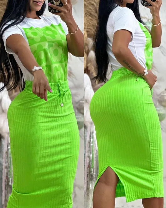 Woman wearing white printed top and bright green mid-calf skirt set