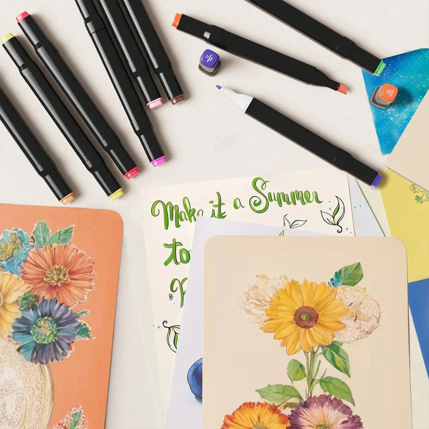 Colorful markers and notebooks with floral designs on a white background. Pro Dual-Tip Alcohol Markers Set featuring fine and chisel tips, vibrant streak-free ink, ergonomic design for artists’ coloring and sketching projects UK.