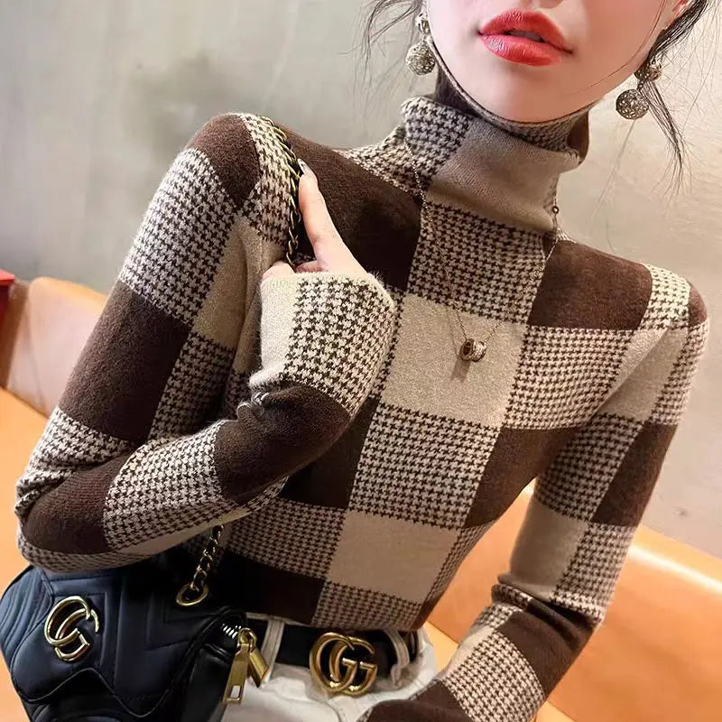 Person wearing a checkered sweater with a blurred background