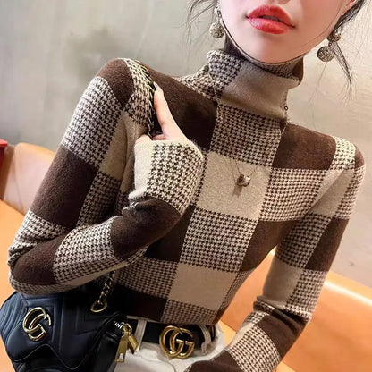 Person wearing a checkered sweater with a blurred background