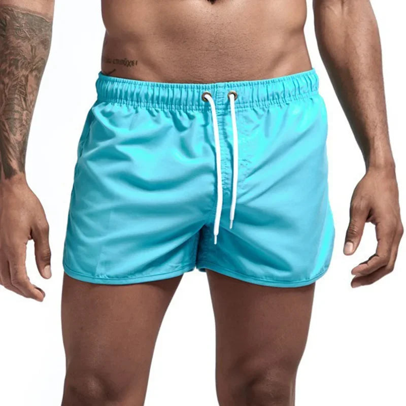 Men's blue quick-drying swimming trunks in vibrant colors for beach and surfing