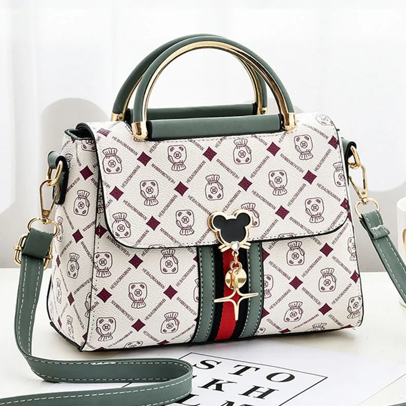 Designer handbag with brand logo on a white background