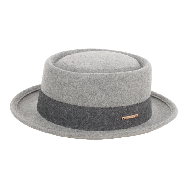 Gray fedora hat with a black band on a white background. Fedora hat polyester unisex carnival mask, gentleman style, costume accessory, roll trim hat for party and carnival events.