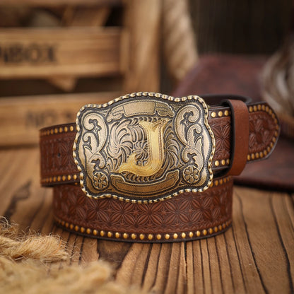 Brown leather belt with intricate gold buckle on a wooden surface