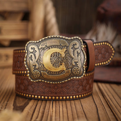 Brown leather belt with a decorative gold buckle on a wooden surface