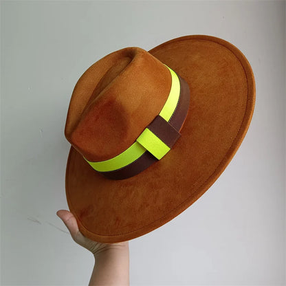 Brown hat with a yellow and brown band held against a gray background