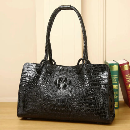 Black crocodile-patterned handbag on a wooden surface with books in the background. Luxury women’s tote bag in genuine red crocodile leather. Large capacity, stylish handle, fashion travel handbag. Perfect for shoulder or portable use UK.