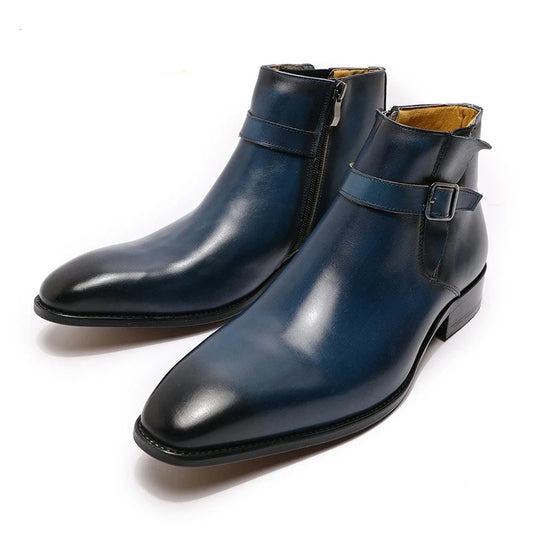 Pair of blue leather boots with buckles on a white background