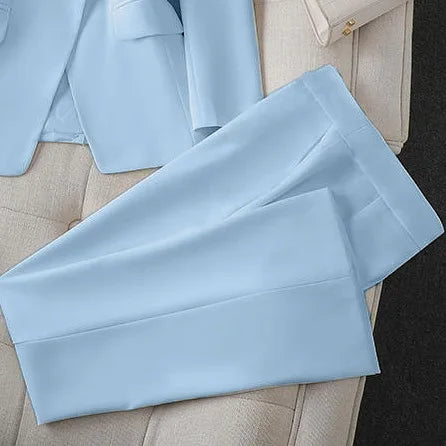 Light blue pants on a light gray surface with a blurred background