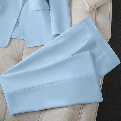 Light blue pants on a light gray surface with a blurred background