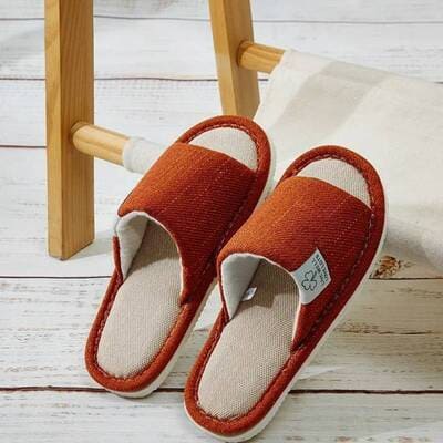 Orange unisex linen home slippers with breathable open-toe design and cushioned non-slip sole for indoor comfort at home.