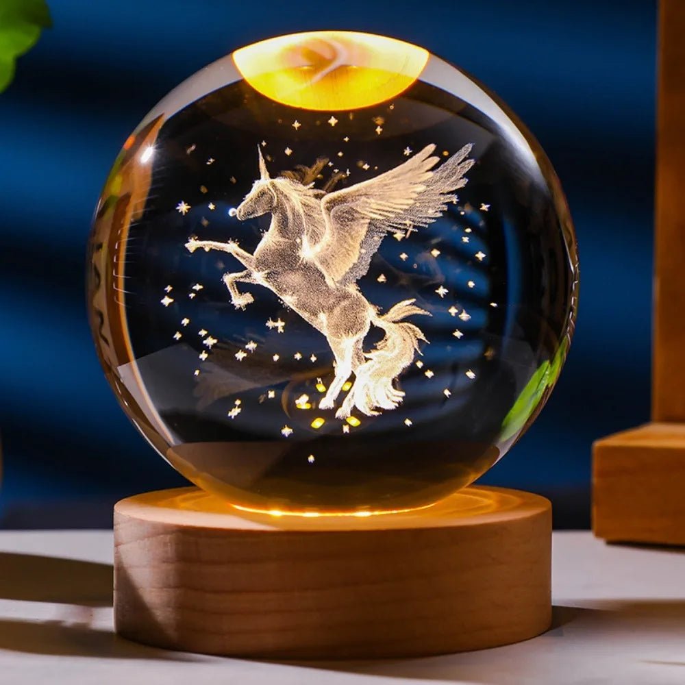Glass orb with unicorn design on a wooden base against a dark background. 3D laser engraved axolotl crystal ball lamp with USB LED base, vibrant colours UK.