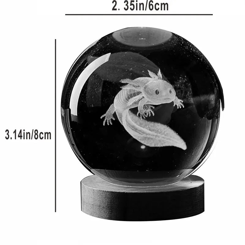 Crystal ball with axolotl engraving on a wooden base, showing measurements. 3D laser engraved axolotl crystal ball lamp with USB LED base, vibrant colours UK.