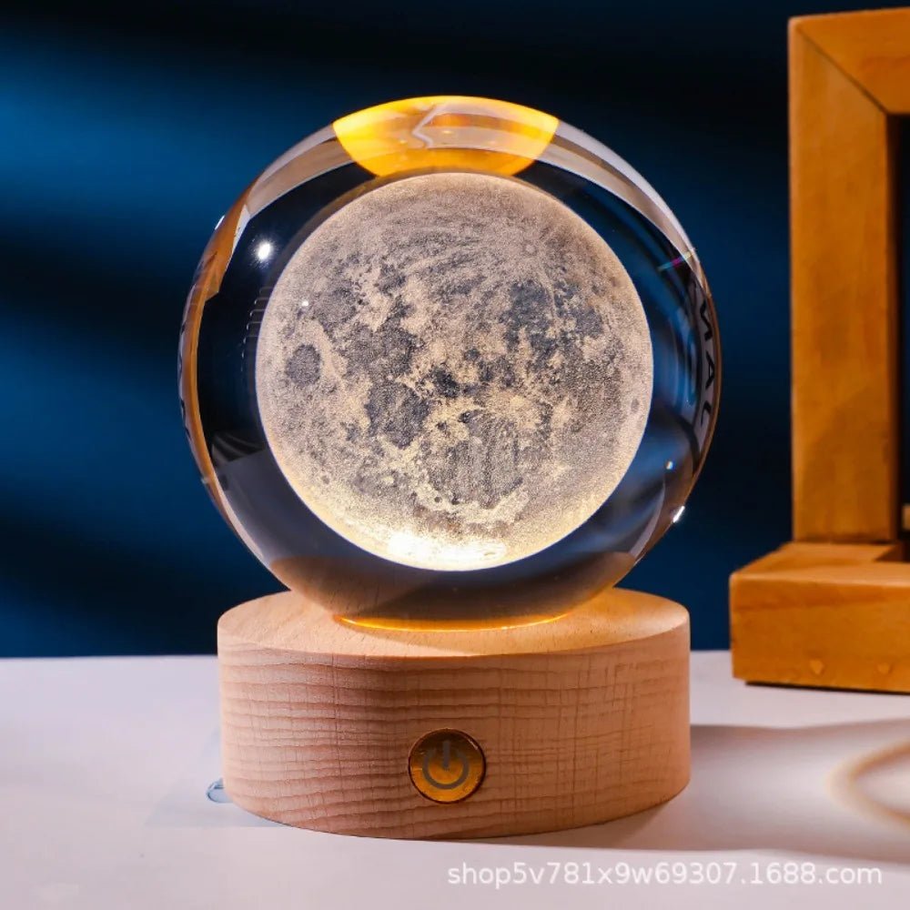 Moon lamp with wooden base on a dark blue background. 3D laser engraved axolotl crystal ball lamp with USB LED base, vibrant colours UK.